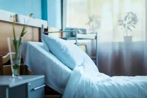 Bed in a bedroom, a common hiding place for bed bugs.